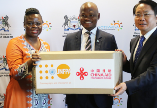 Health Minister Hon. Dr Edwin Dikoloti receiving the donation for reproductive health commodities from UNFPA Botswana Head of Of