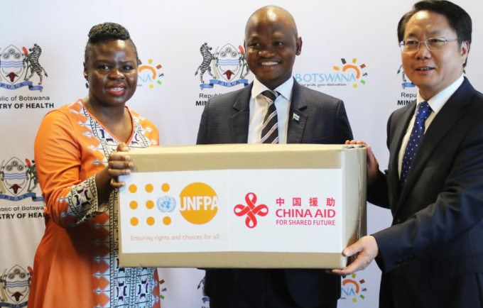 Health Minister Hon. Dr Edwin Dikoloti receiving the donation for reproductive health commodities from UNFPA Botswana Head of Of