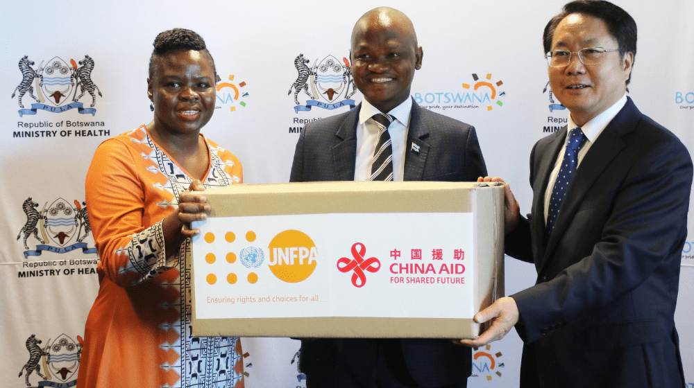 Health Minister Hon. Dr Edwin Dikoloti receiving the donation for reproductive health commodities from UNFPA Botswana Head of Of